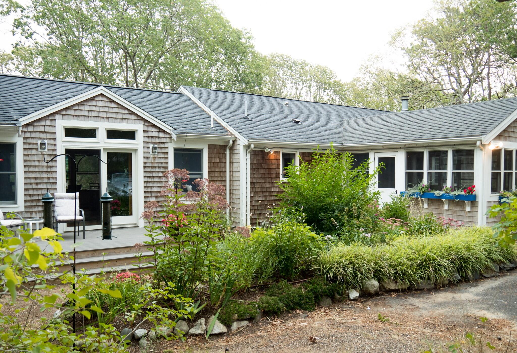 50 Slow Turtle Way Wellfleet, MA 02667 - Photo 31 of 37 a front view of a house with a yard