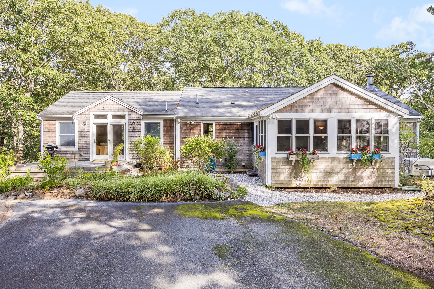 50 Slow Turtle Way Wellfleet, MA 02667 - Photo 34 of 37 a front view of a house with a yard table and chairs