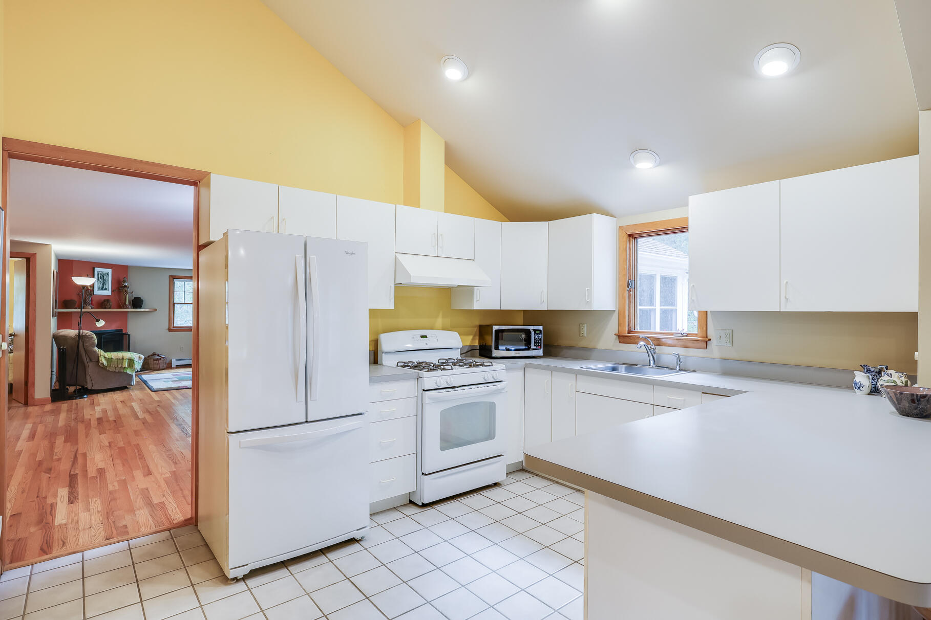50 Slow Turtle Way Wellfleet, MA 02667 - Photo 6 of 37 a kitchen with a sink a refrigerator and cabinets