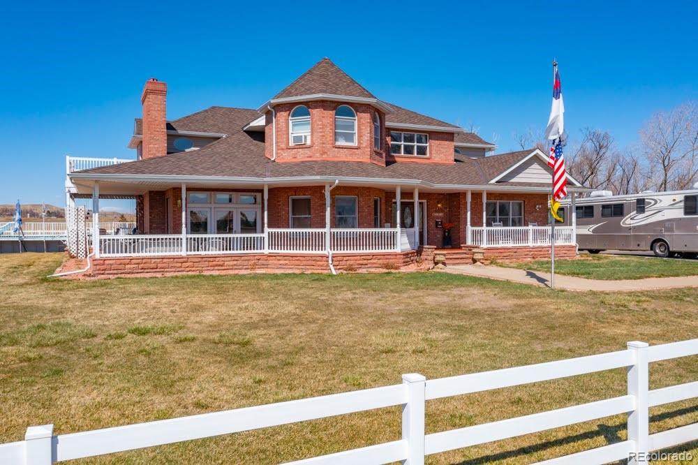 8283 Hygiene Road Longmont, CO 80503 - Photo 2 of 27 a front view of a house with a yard