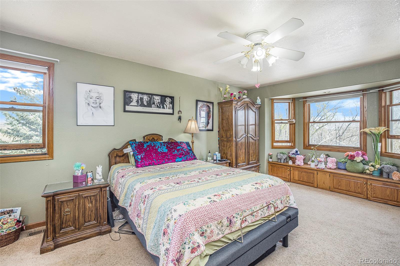 8283 Hygiene Road Longmont, CO 80503 - Photo 23 of 27 a bedroom with a bed and a chandelier