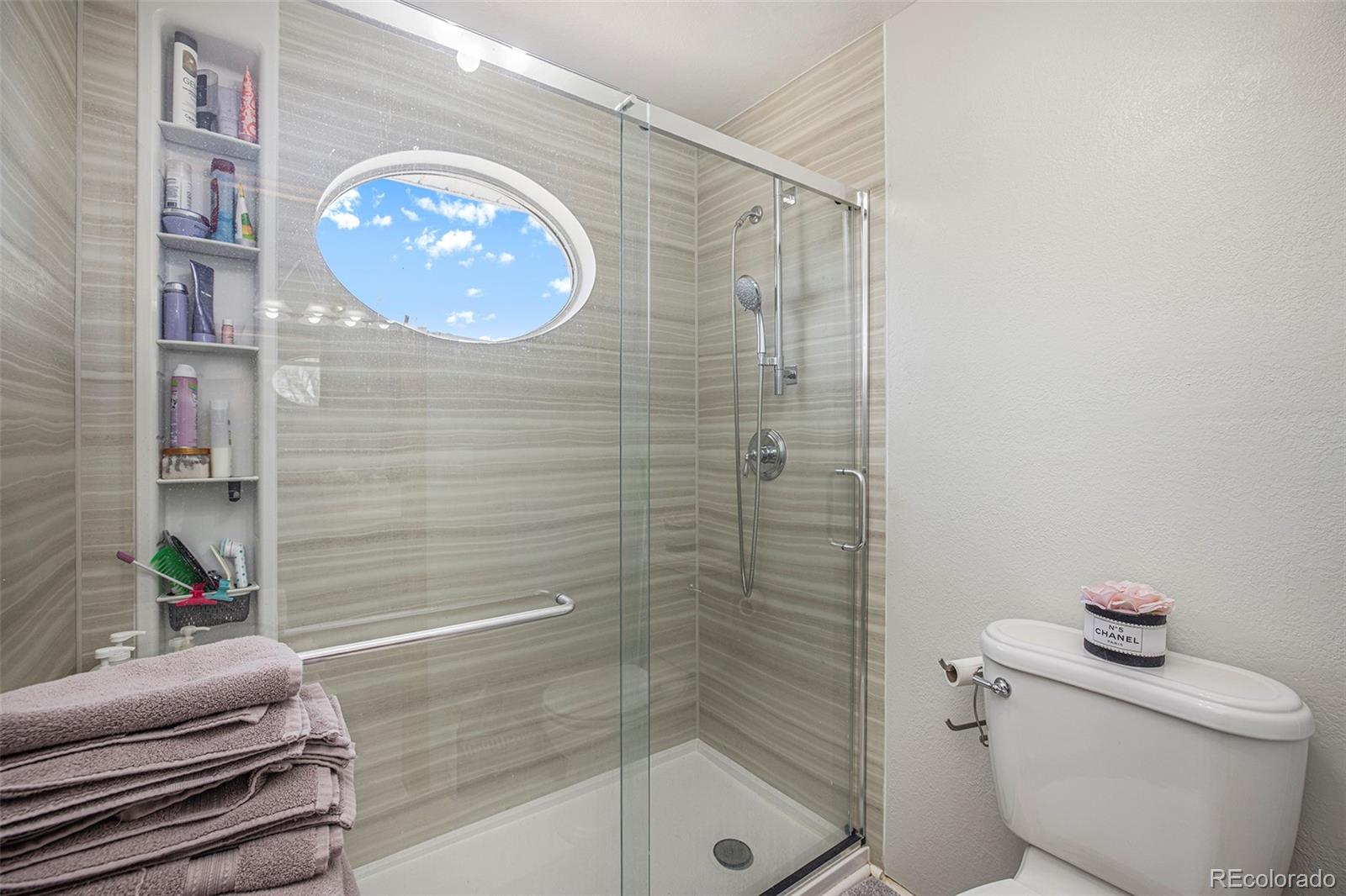 8283 Hygiene Road Longmont, CO 80503 - Photo 27 of 27 a bathroom with a toilet and a shower