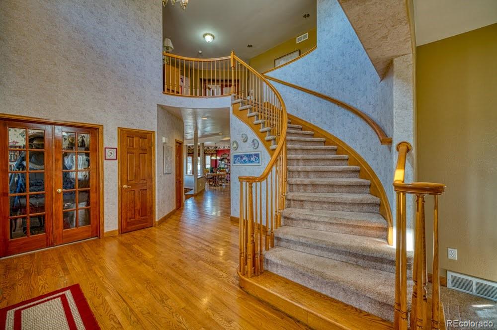 8283 Hygiene Road Longmont, CO 80503 - Photo 5 of 27 a view of entryway and hall with wooden floor