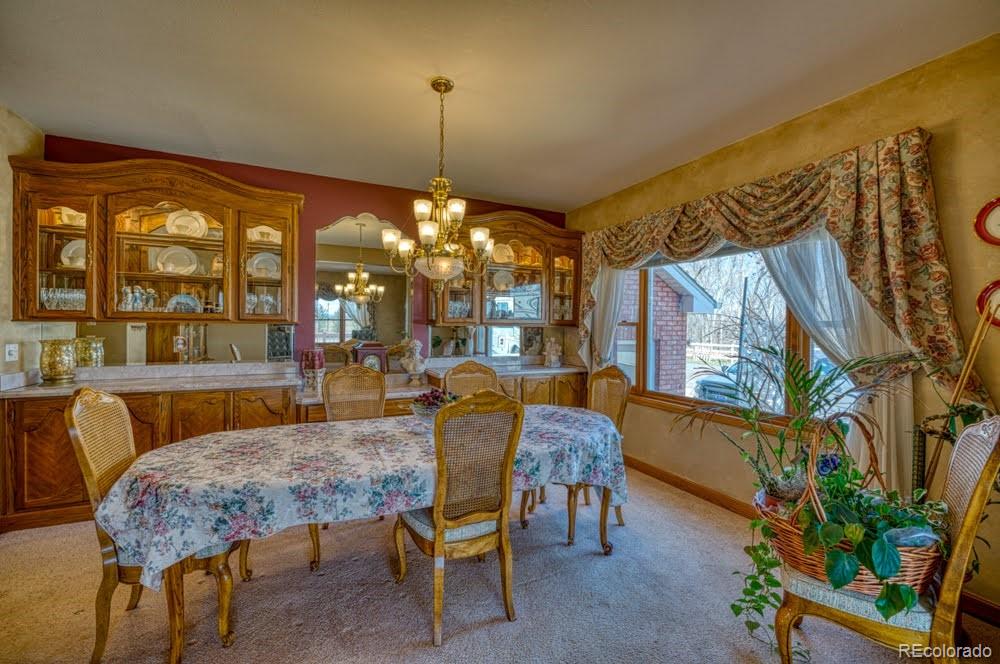 8283 Hygiene Road Longmont, CO 80503 - Photo 7 of 27 a view of a dining room with furniture window and outside view