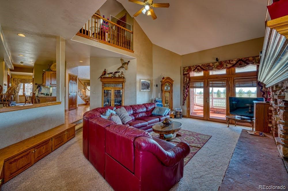 8283 Hygiene Road Longmont, CO 80503 - Photo 9 of 27 a living room with furniture rug and wooden floor