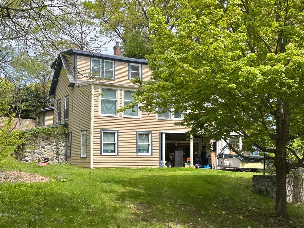 12 Whipple Street Danvers, MA 01923 - Photo 2 of 2 front view of a house with a yard