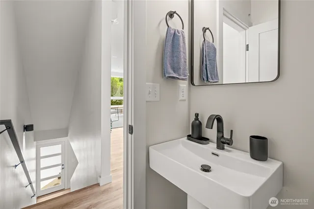 a bathroom with a sink and a mirror