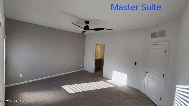 a bathroom with a shower sink vanity and mirror
