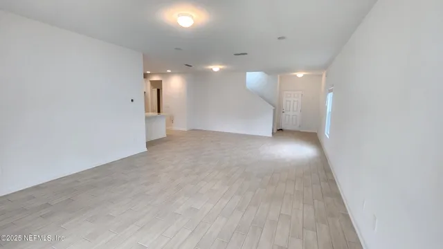 a view of a big room with wooden floor