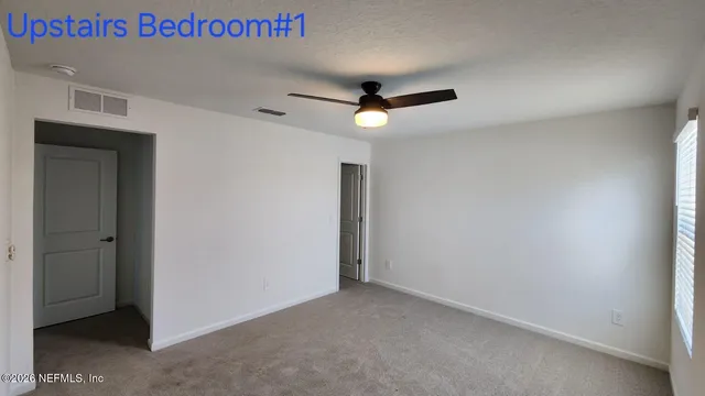 a close up of a refrigerator with white wall