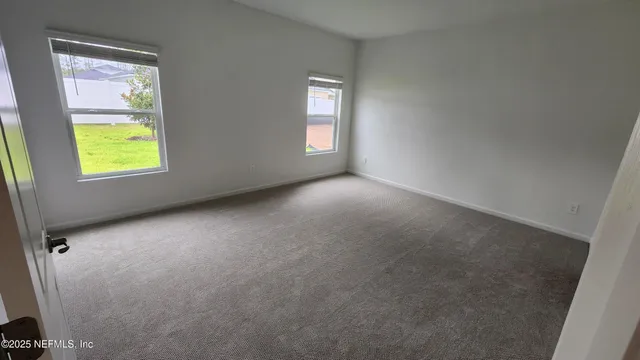 a bathroom with a double vanity sink a mirror and a vanity