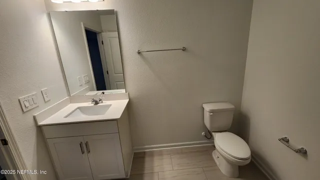 a white bath tub sitting next to a white sink