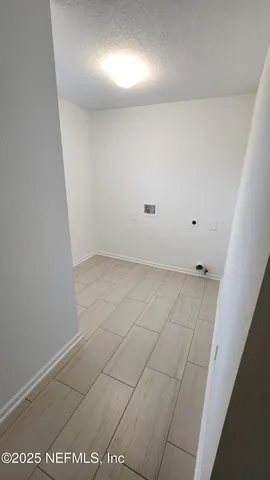 wooden floor and window in a room