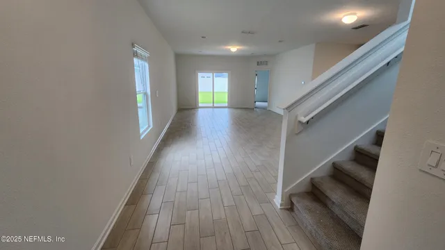 a view of entryway with wooden floor