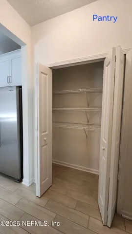 a kitchen with a stove and a microwave