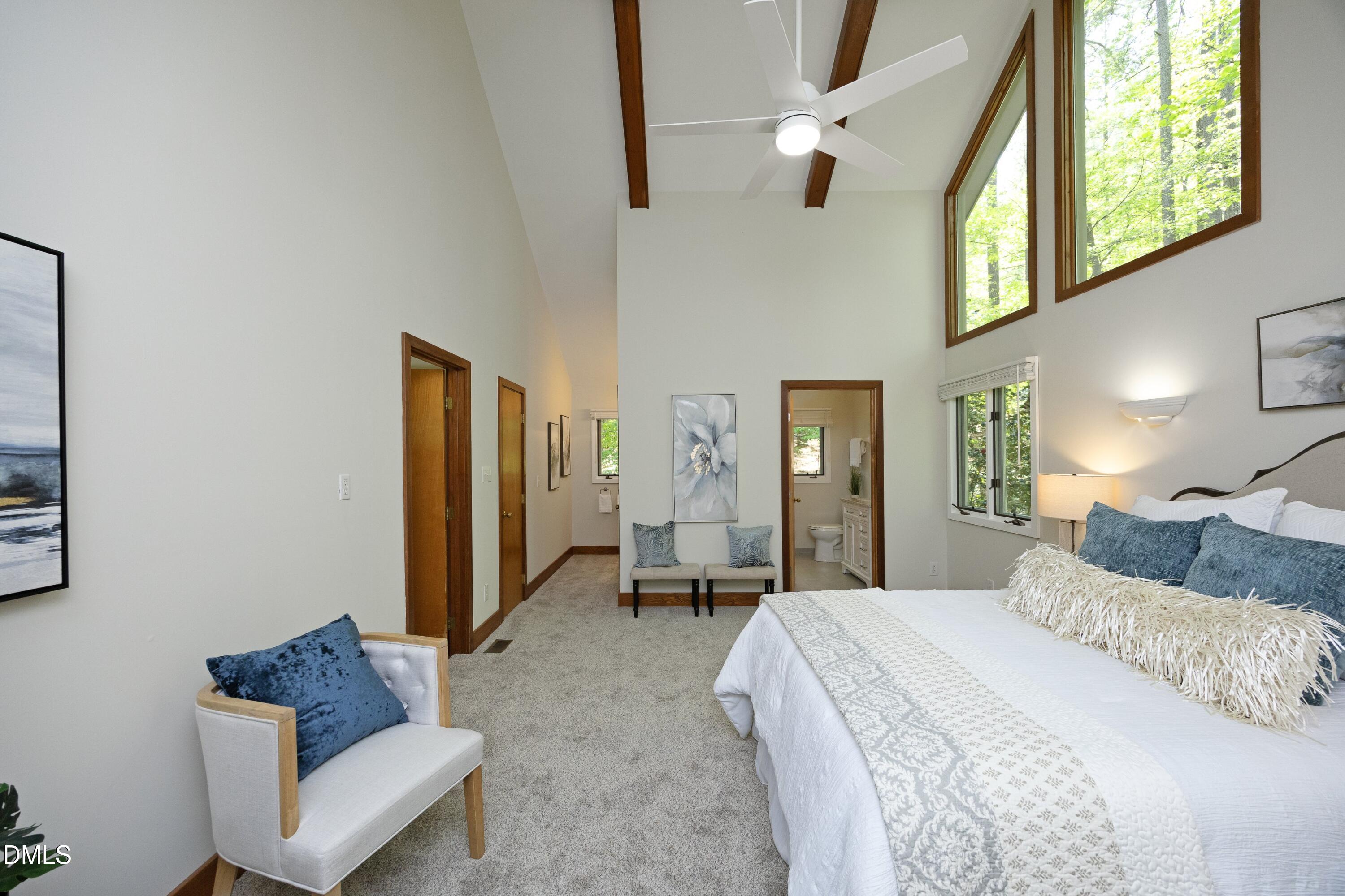 5321 Taproot Lane Durham, NC 27705 - Photo 12 of 27 a bedroom with a bed couch and a window