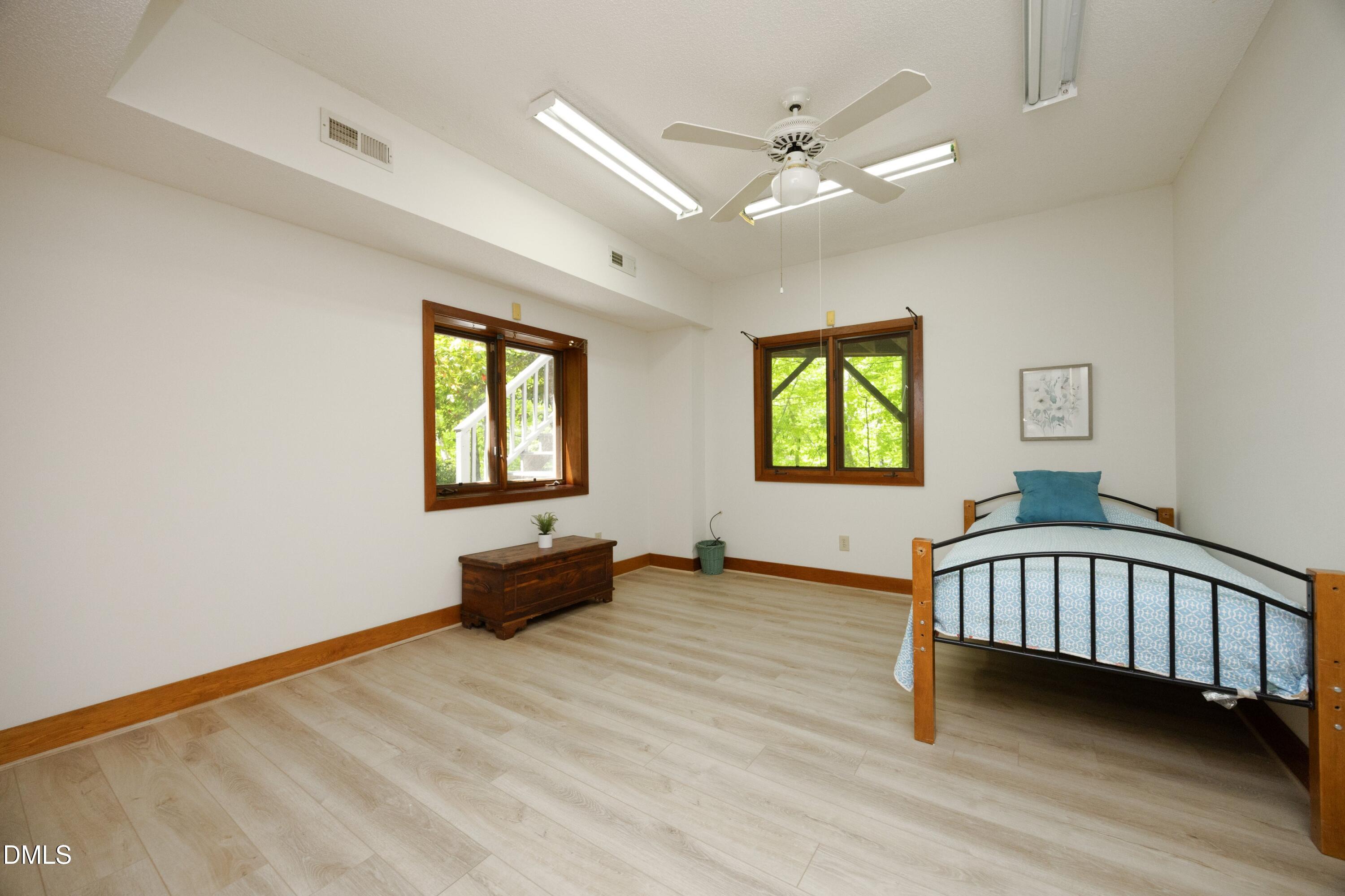 5321 Taproot Lane Durham, NC 27705 - Photo 22 of 27 a view of a bedroom with furniture and a window