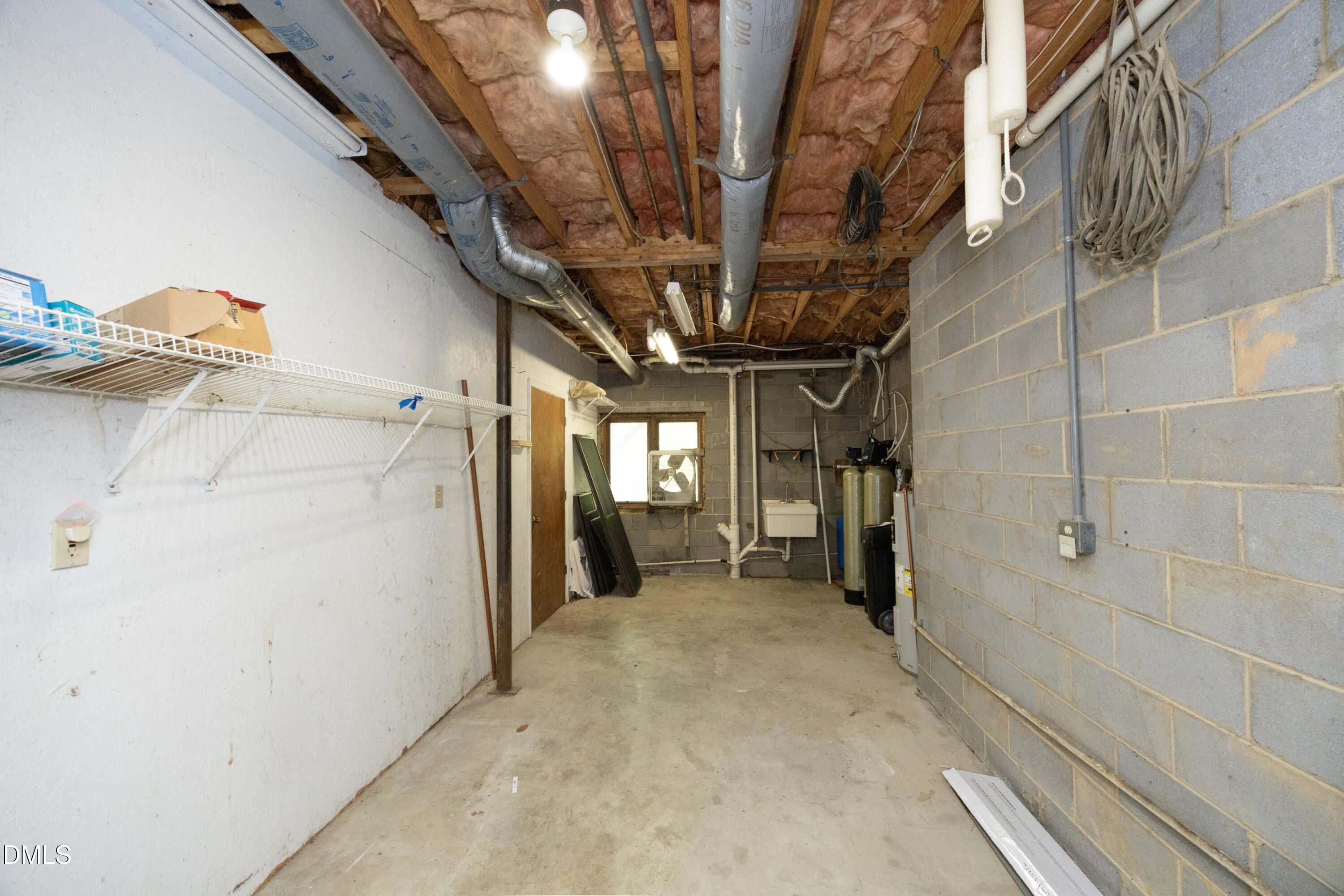 5321 Taproot Lane Durham, NC 27705 - Photo 26 of 27 a view of a hallway with a car parked in garage