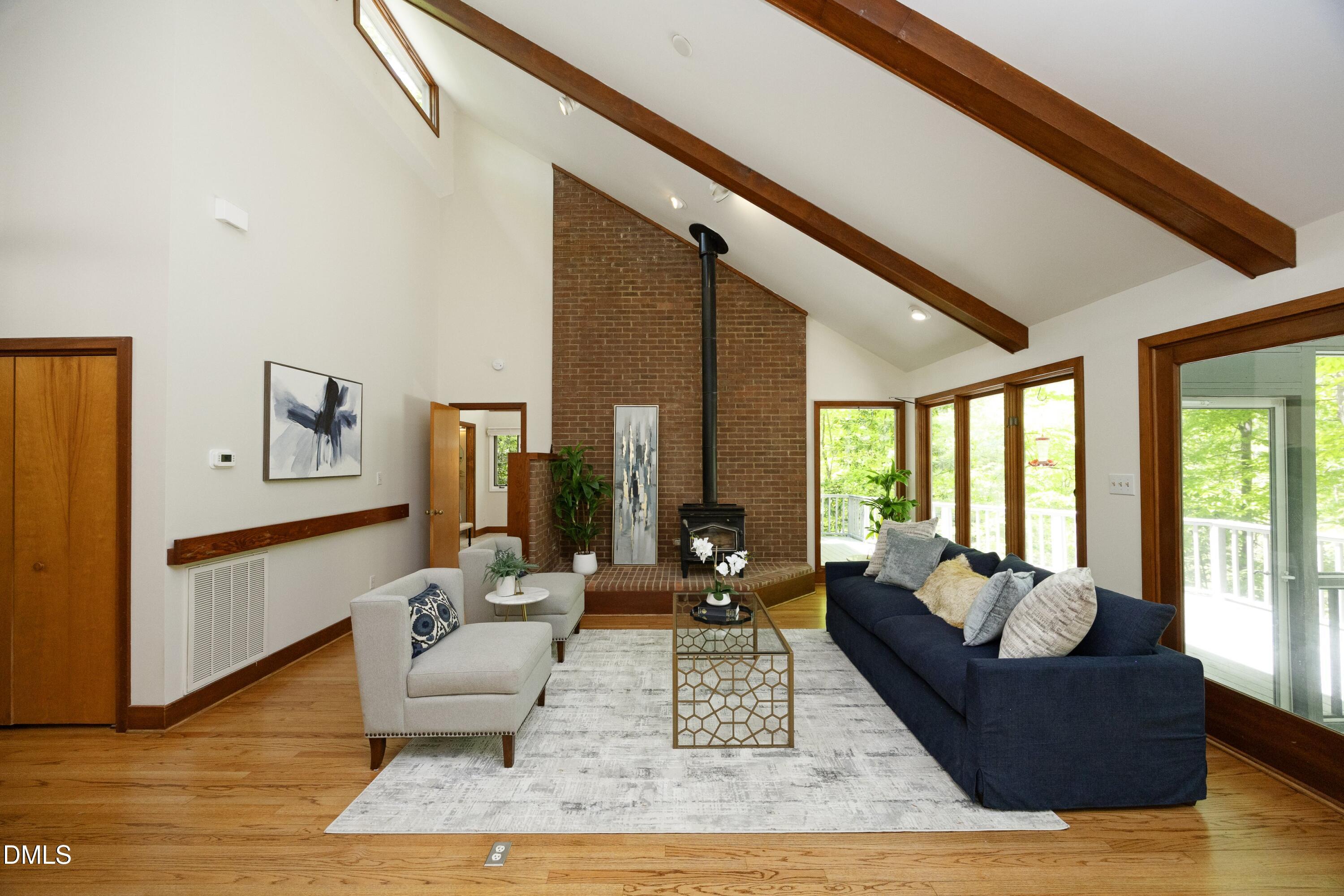 5321 Taproot Lane Durham, NC 27705 - Photo 6 of 27 a living room with furniture and large windows
