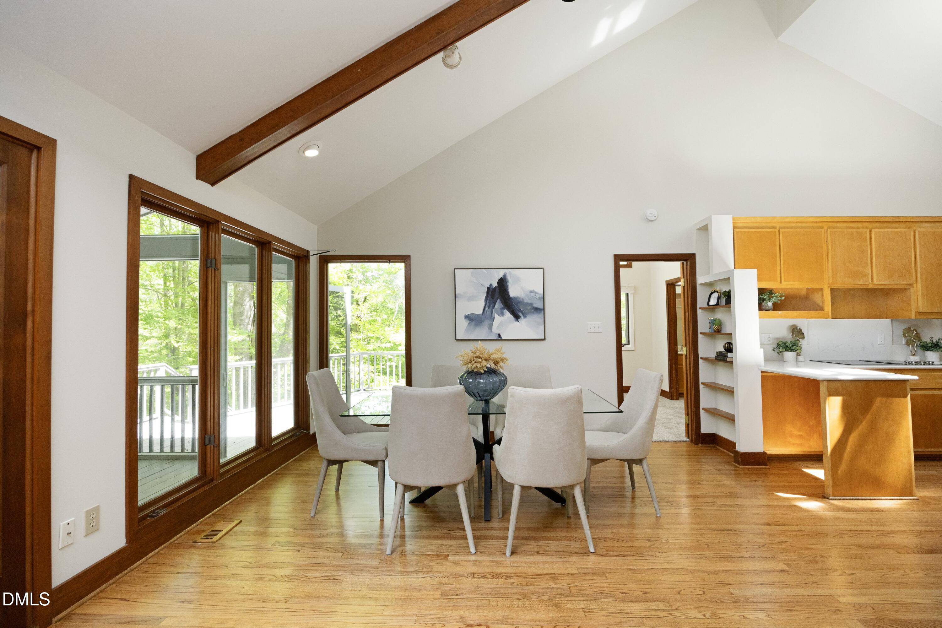 5321 Taproot Lane Durham, NC 27705 - Photo 7 of 27 a view of a dining room with furniture and wooden floor