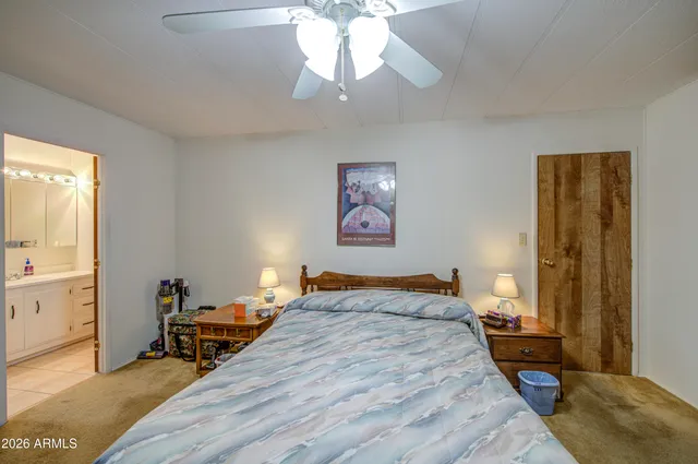 a bedroom with bed and window