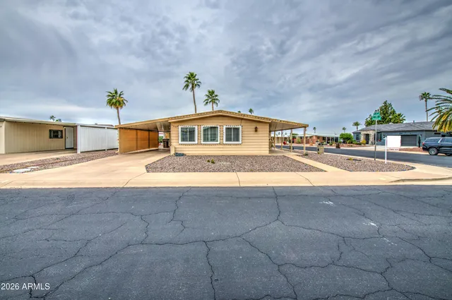 a view of swimming pool with outdoor seating and yard in back