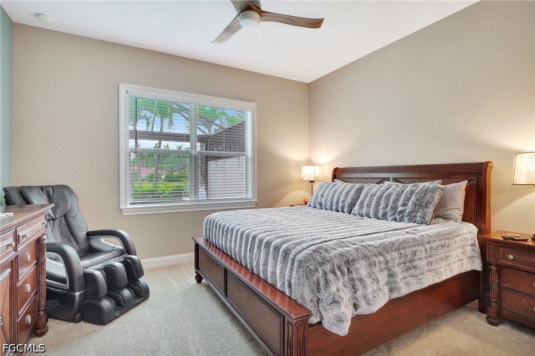 11230 Suffield Street Fort Myers, FL 33913 - Photo 14 of 42 a bedroom with a bed and a window