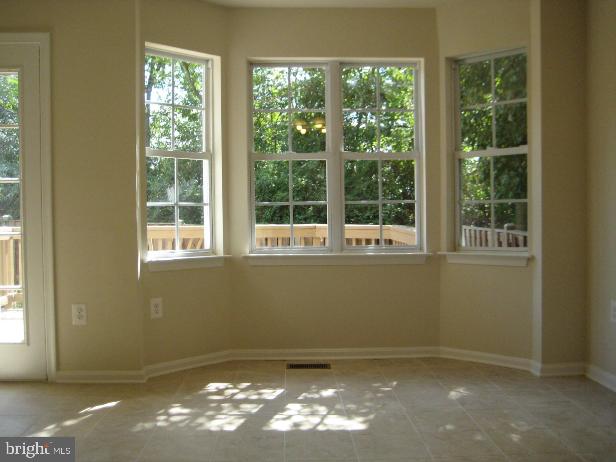 9219 Ridgefield Circle Frederick, MD 21701 - Photo 4 of 17 NEW 12x12 CERAMIC FLOORS IN KITCHEN