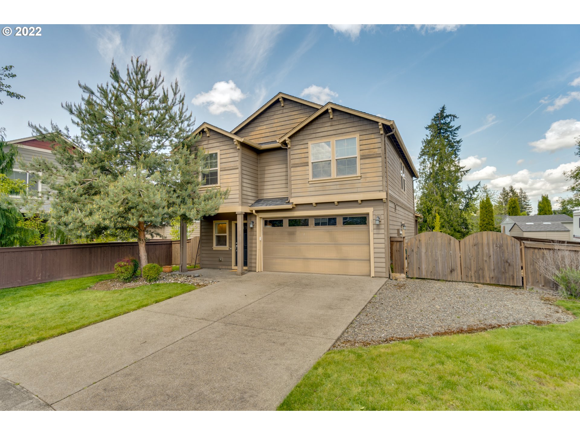 4310 North 4th Circle Ridgefield, WA 98642 - Photo 1 of 27 a view of a house with a yard and potted plants