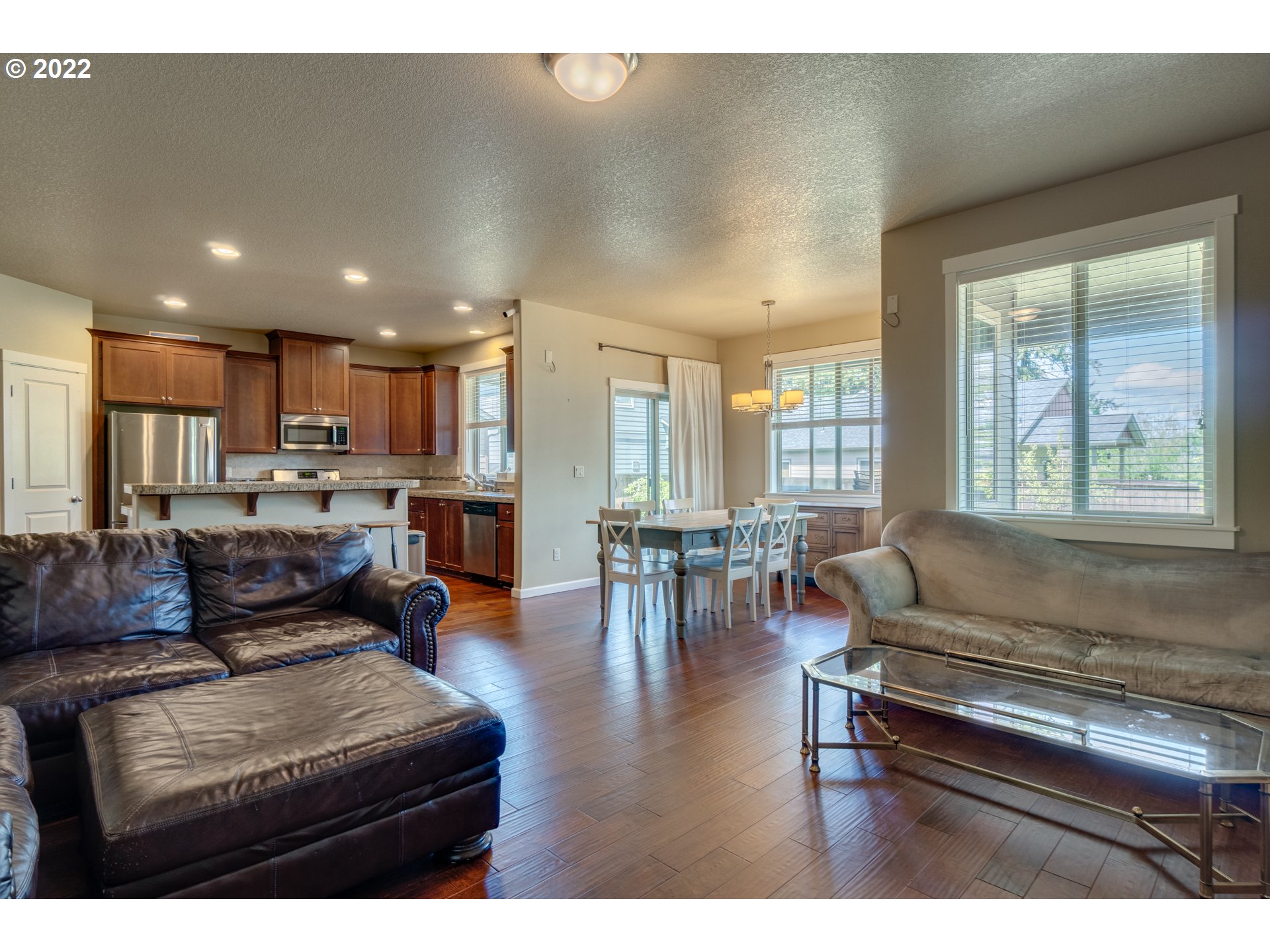 4310 North 4th Circle Ridgefield, WA 98642 - Photo 13 of 27 a living room with furniture and a large window