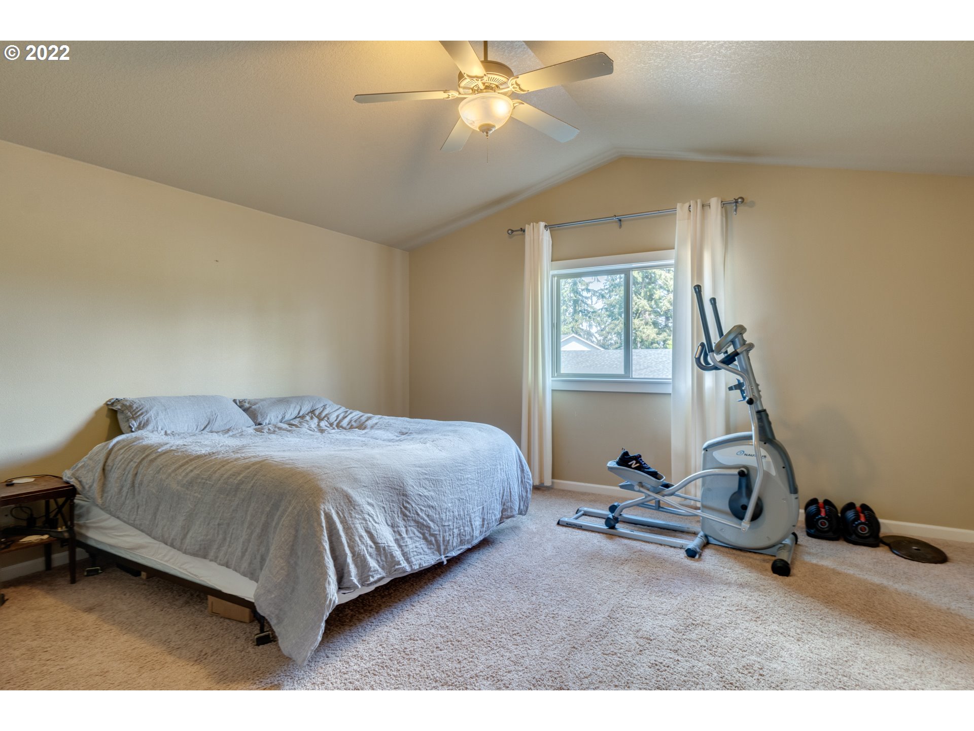 4310 North 4th Circle Ridgefield, WA 98642 - Photo 15 of 27 a bedroom with a bed and a window