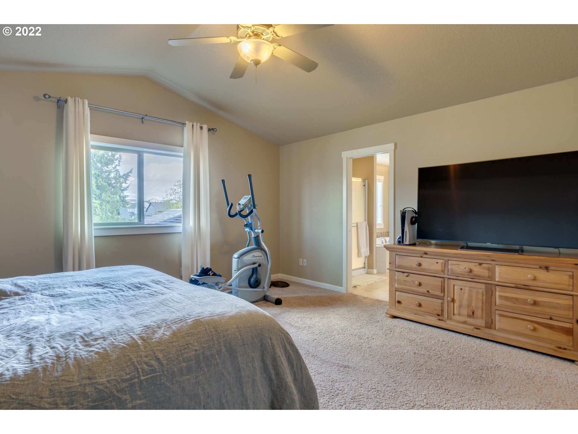 4310 North 4th Circle Ridgefield, WA 98642 - Photo 16 of 27 a bedroom with a bed and flat screen tv