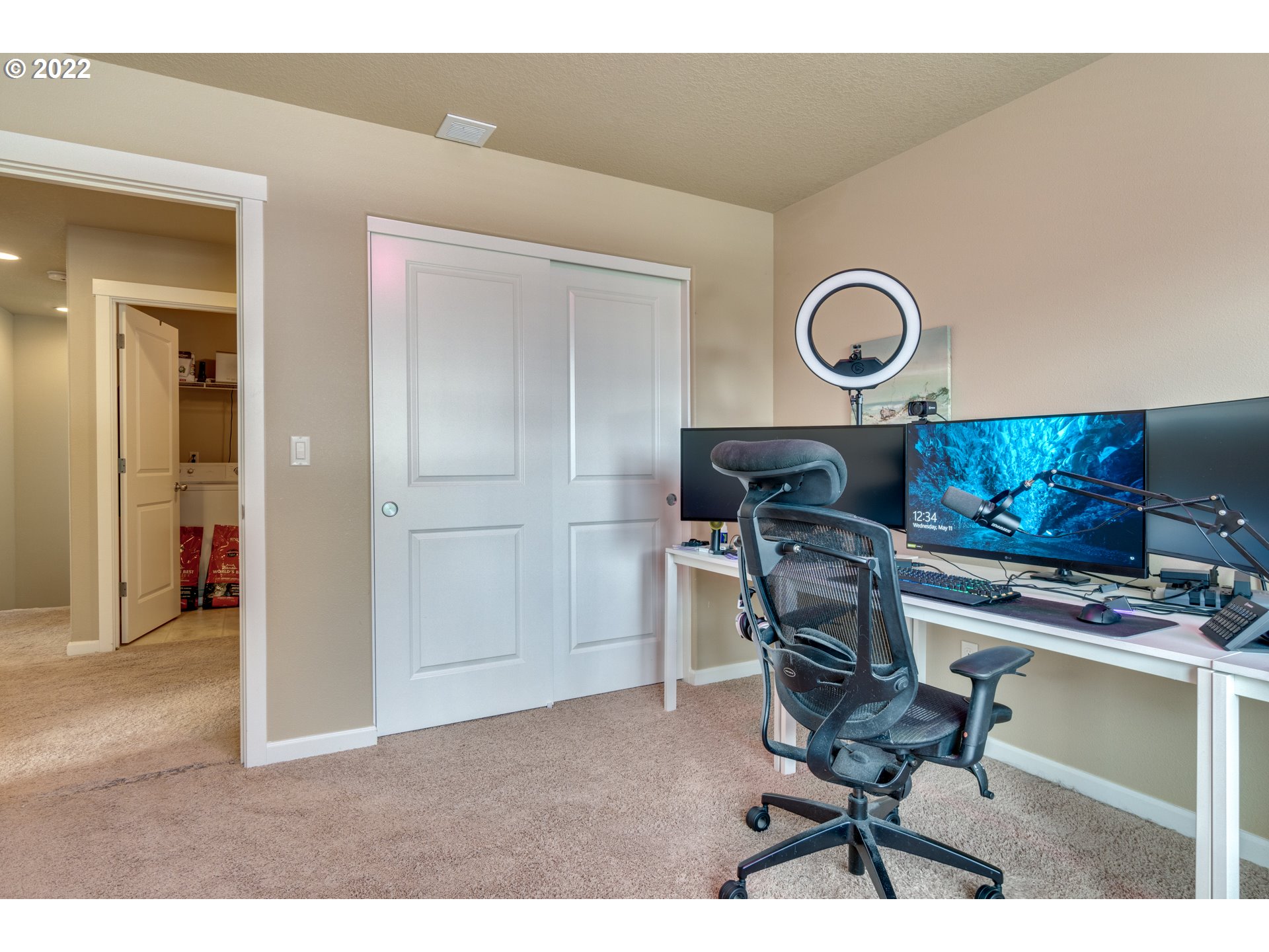 4310 North 4th Circle Ridgefield, WA 98642 - Photo 20 of 27 a kitchen with a sink and a stove with a chair