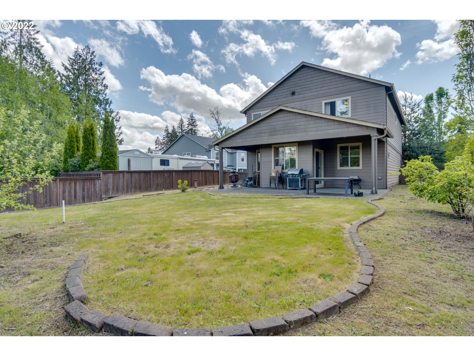 4310 North 4th Circle Ridgefield, WA 98642 - Photo 27 of 27 a view of a house with swimming pool and a yard