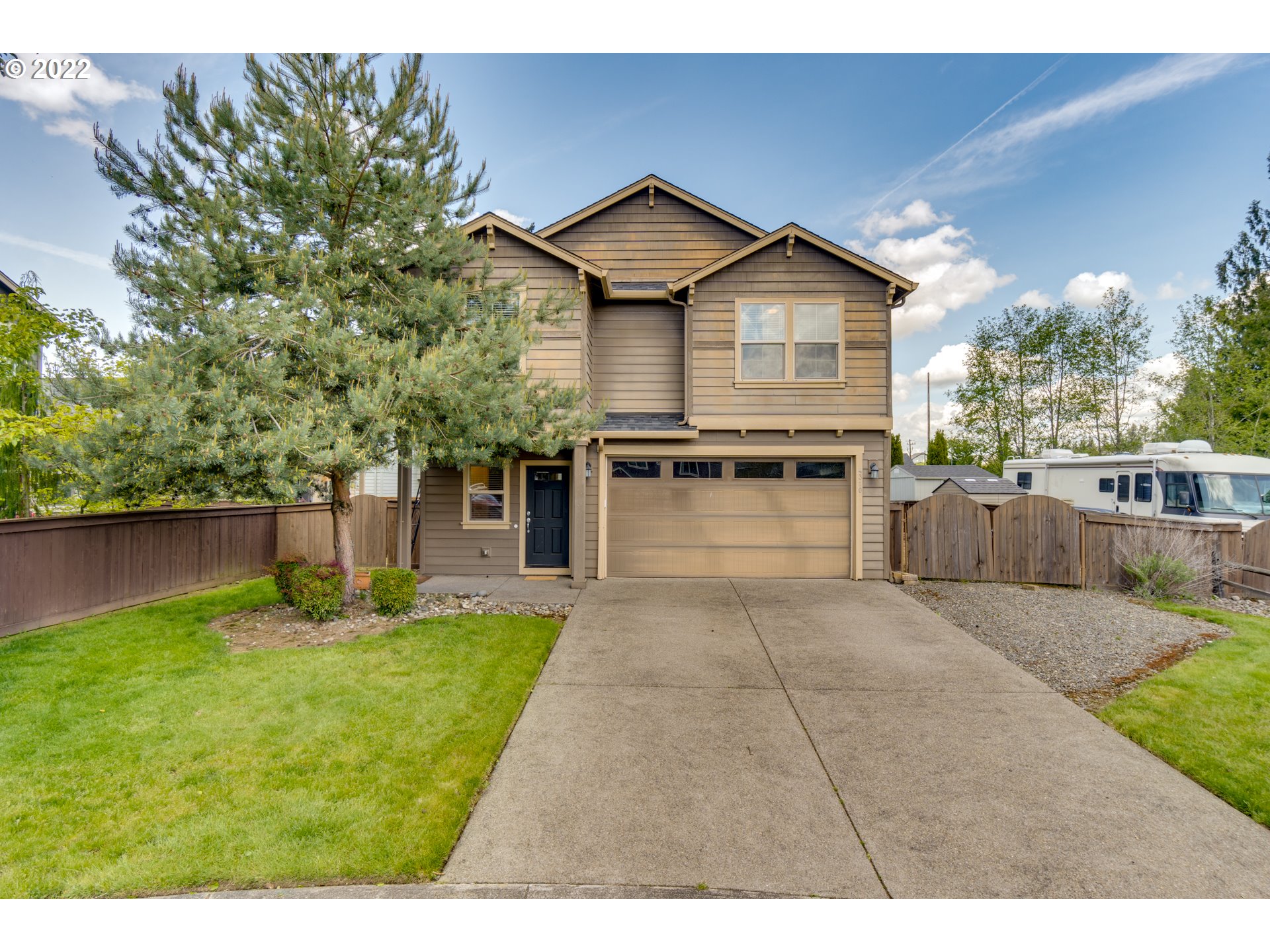 4310 North 4th Circle Ridgefield, WA 98642 - Photo 3 of 27 a front view of a house with garden