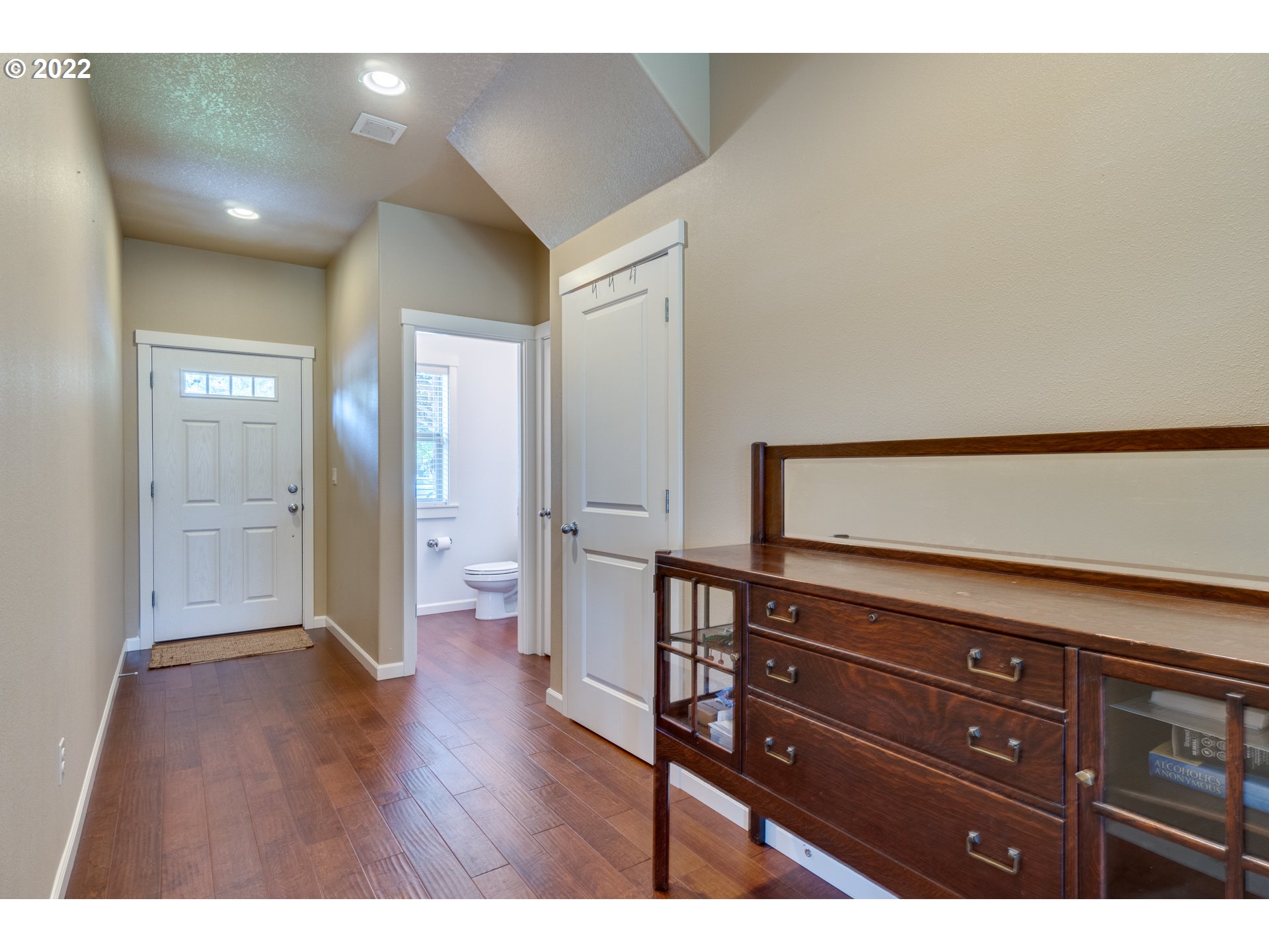 4310 North 4th Circle Ridgefield, WA 98642 - Photo 5 of 27 a view of a hallway with wooden floor