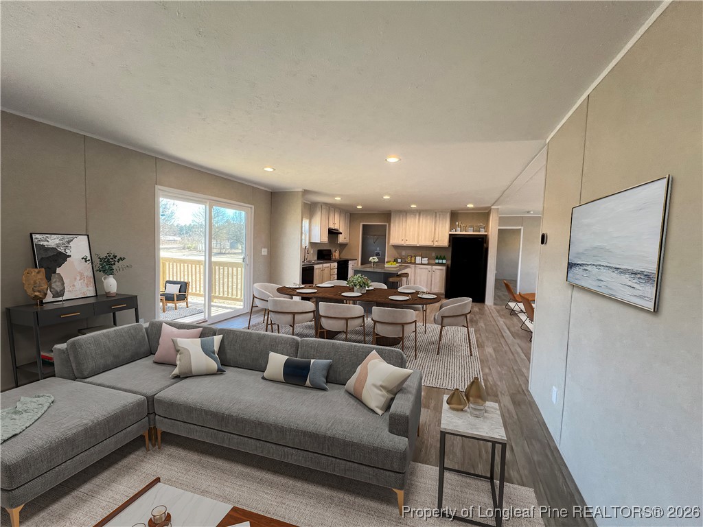 801 Horseshoe Road Autryville, NC 28318 - Photo 20 of 31 Den & Dining areas with virtual staging