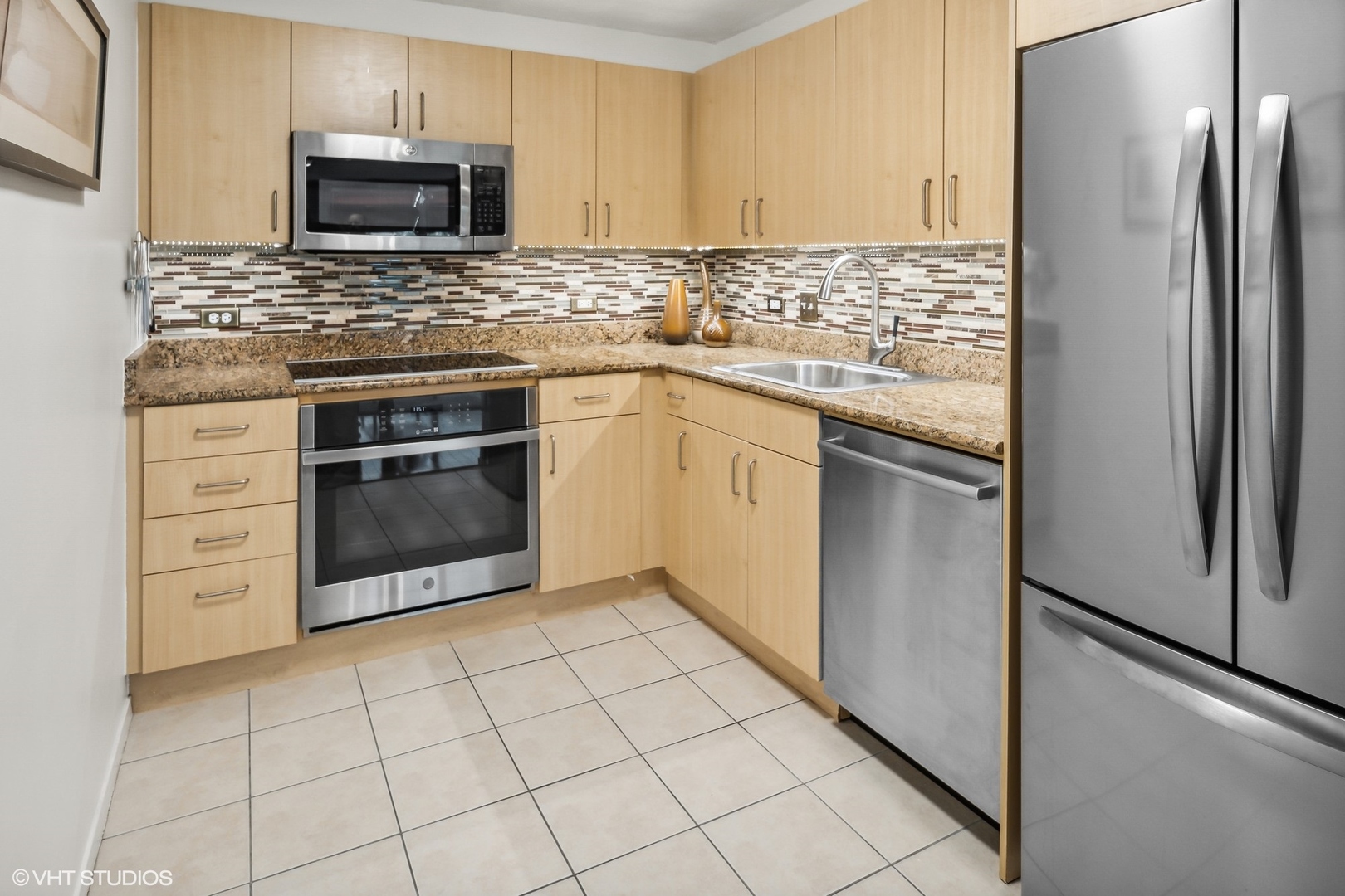 800 Elgin Road, Unit 614 Evanston, IL 60201 - Photo 3 of 17 a kitchen with cabinets stainless steel appliances and a counter space