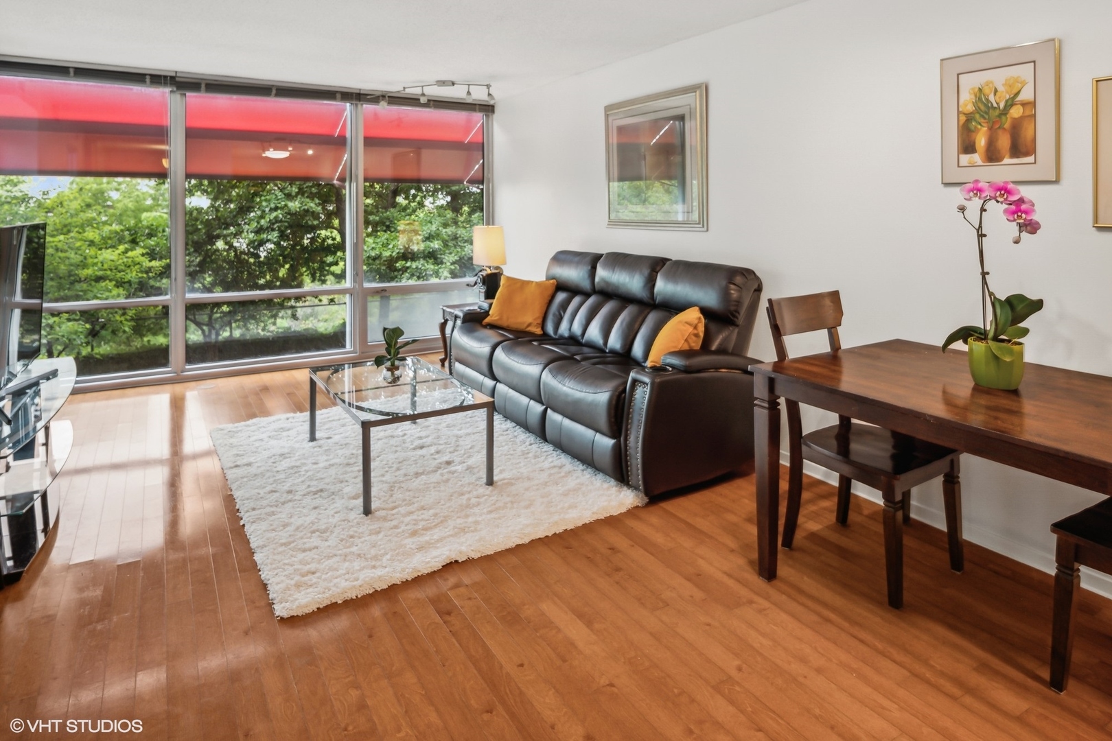 800 Elgin Road, Unit 614 Evanston, IL 60201 - Photo 6 of 17 a living room with furniture and a large window