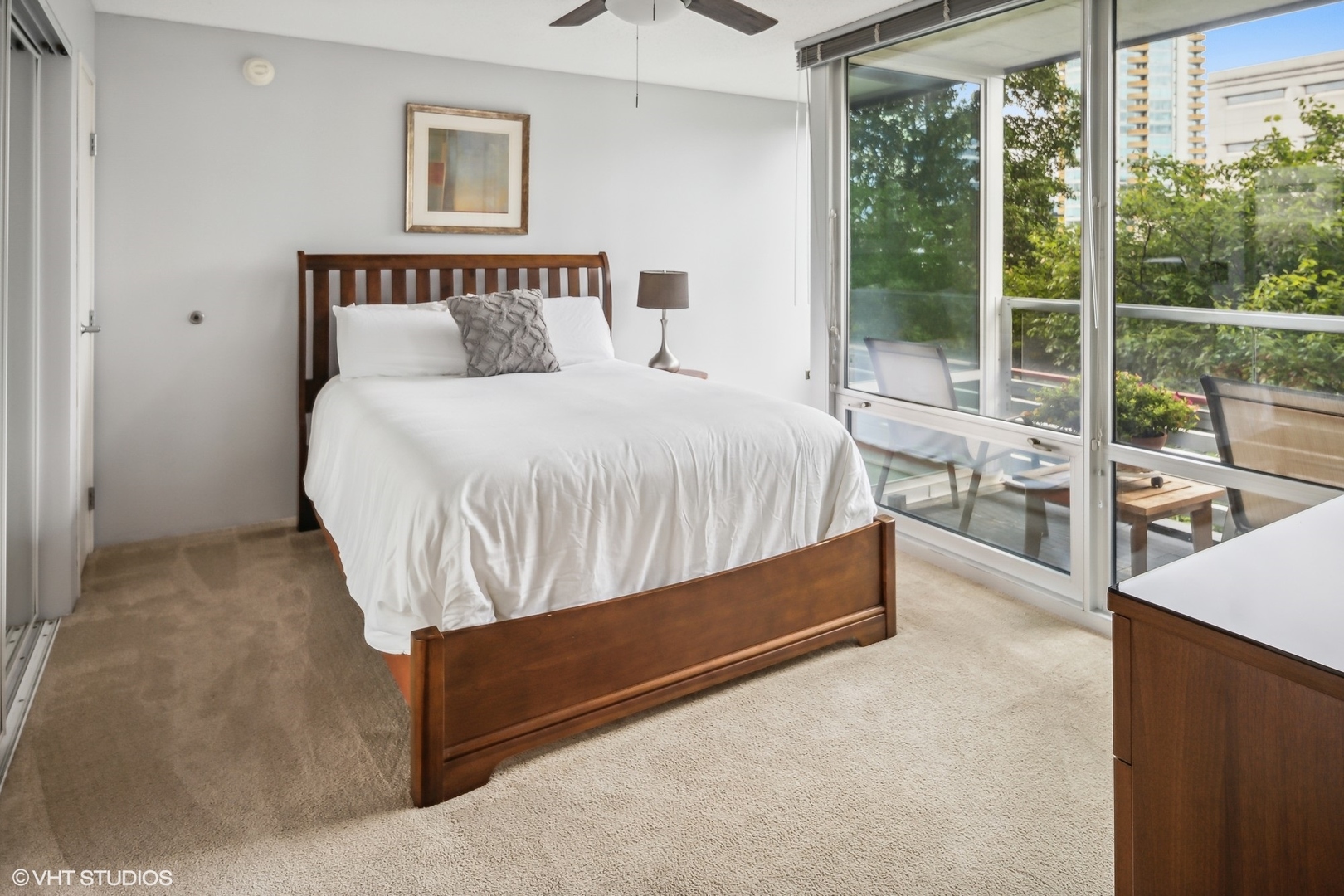 800 Elgin Road, Unit 614 Evanston, IL 60201 - Photo 8 of 17 a bed sitting in a bedroom next to a window