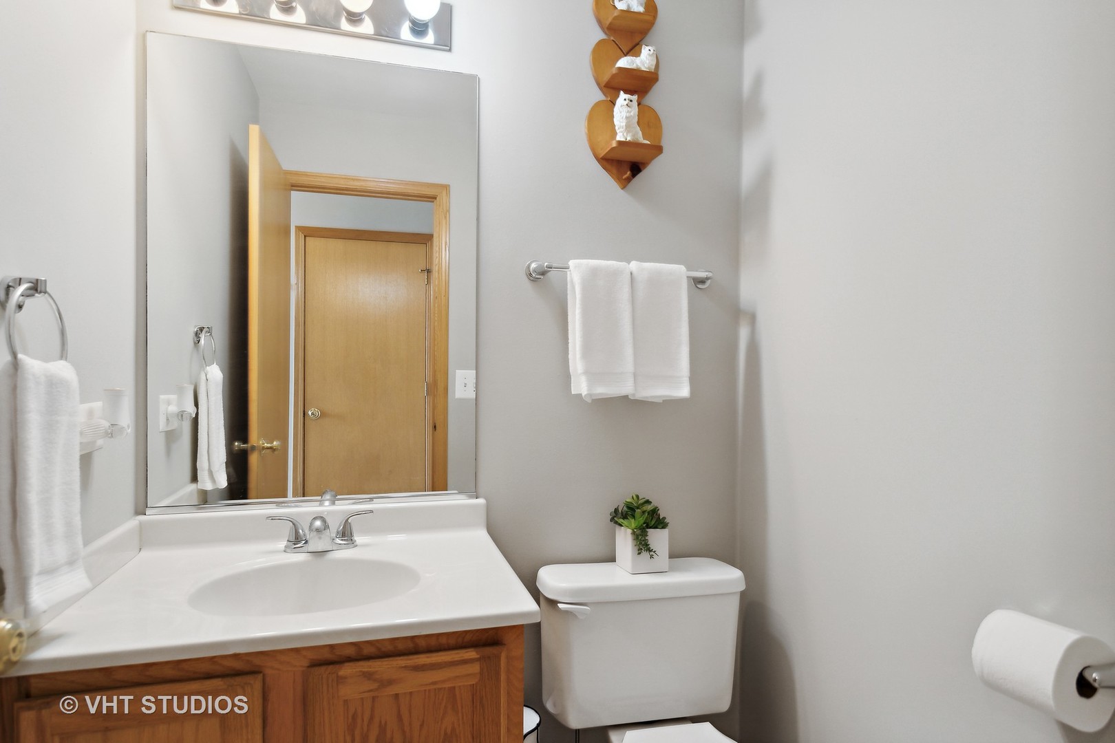 946 Premrose Court Romeoville, IL 60446 - Photo 11 of 25 a bathroom with a sink vanity mirror and toilet
