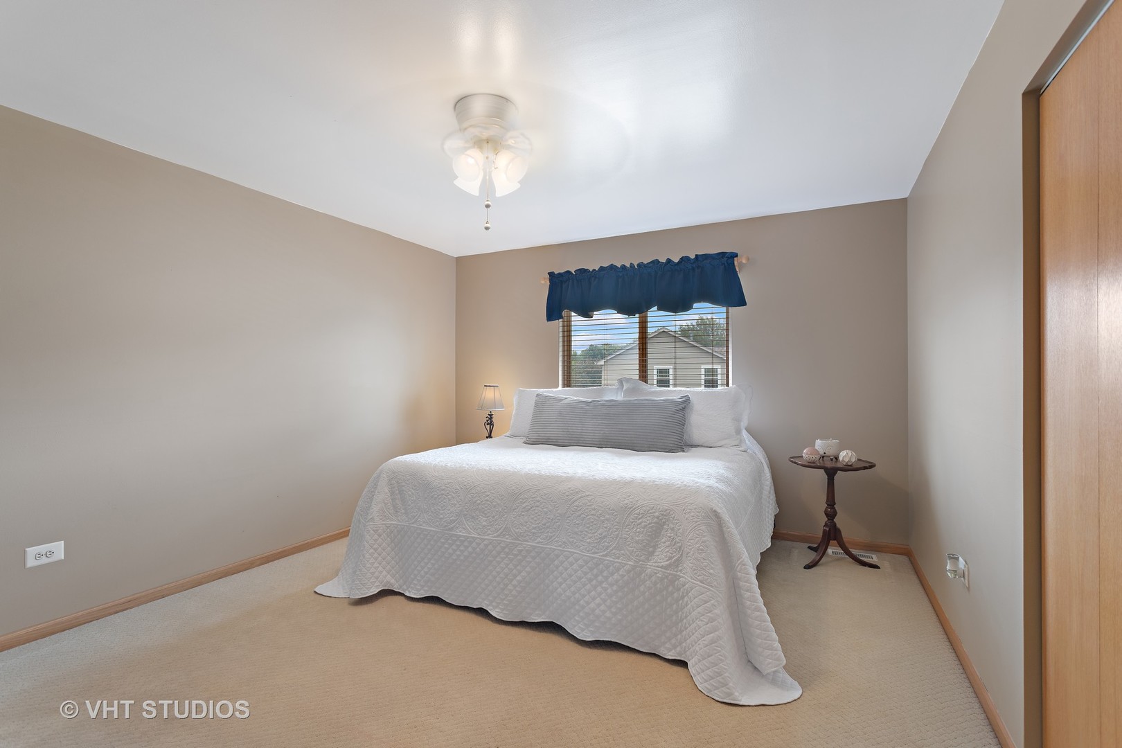 946 Premrose Court Romeoville, IL 60446 - Photo 15 of 25 a bedroom with a bed and a chandelier