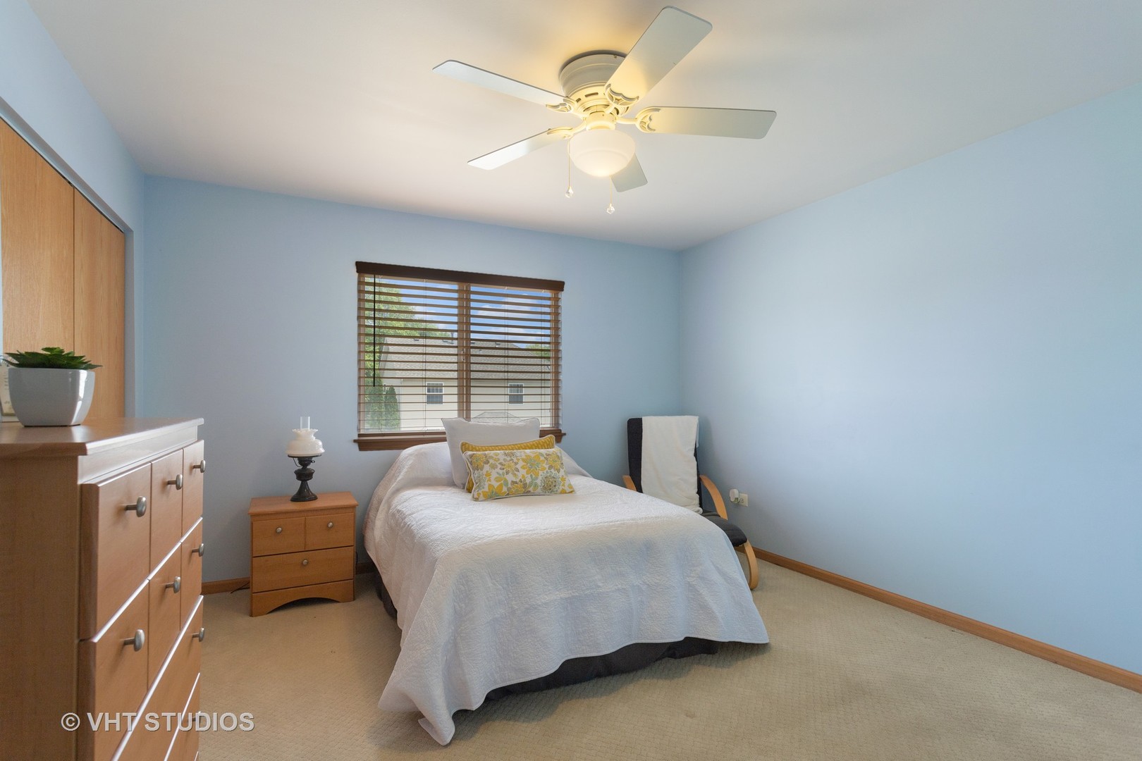 946 Premrose Court Romeoville, IL 60446 - Photo 16 of 25 a spacious bedroom with a bed and a chandelier