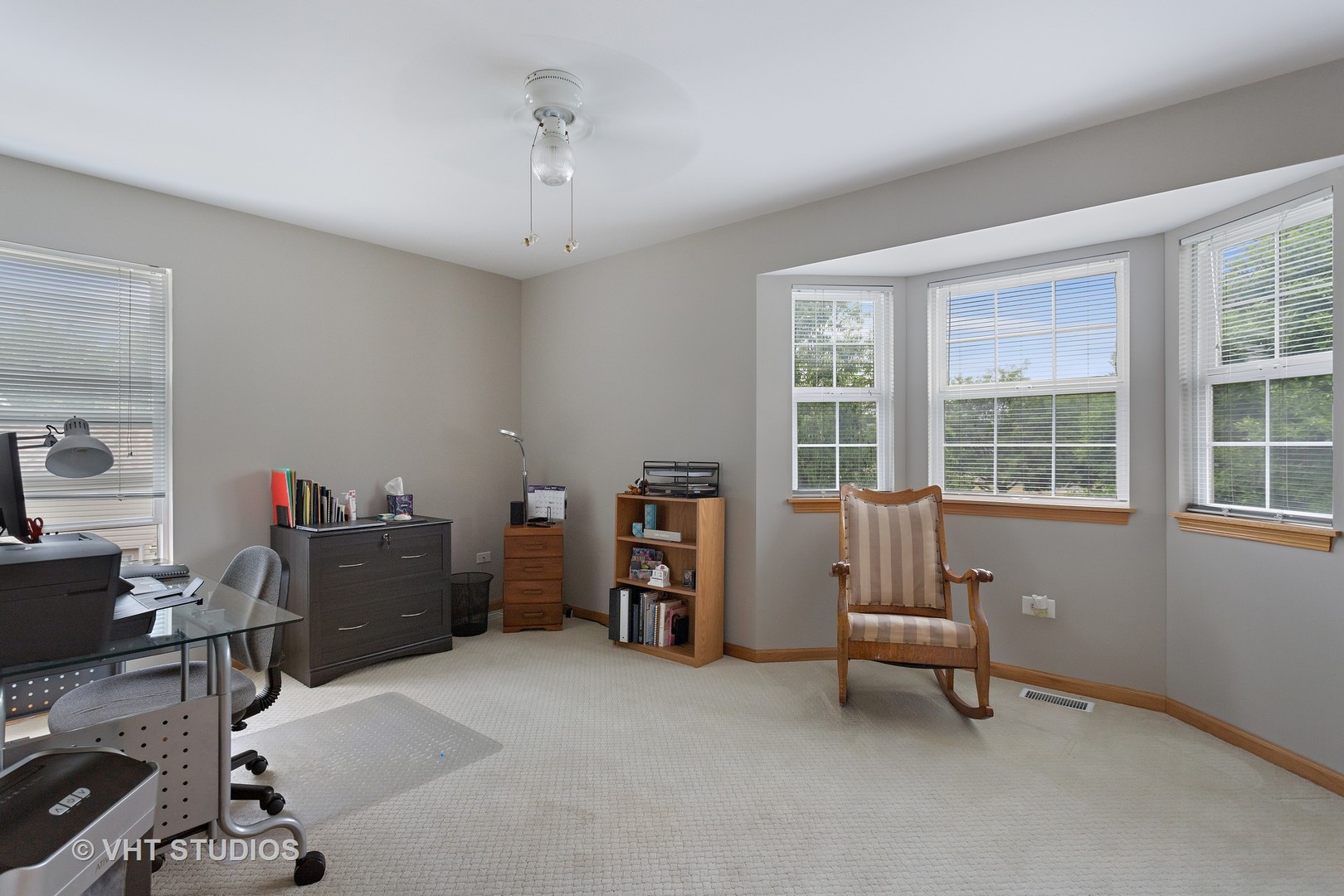 946 Premrose Court Romeoville, IL 60446 - Photo 17 of 25 a view of a workspace with furniture and a window