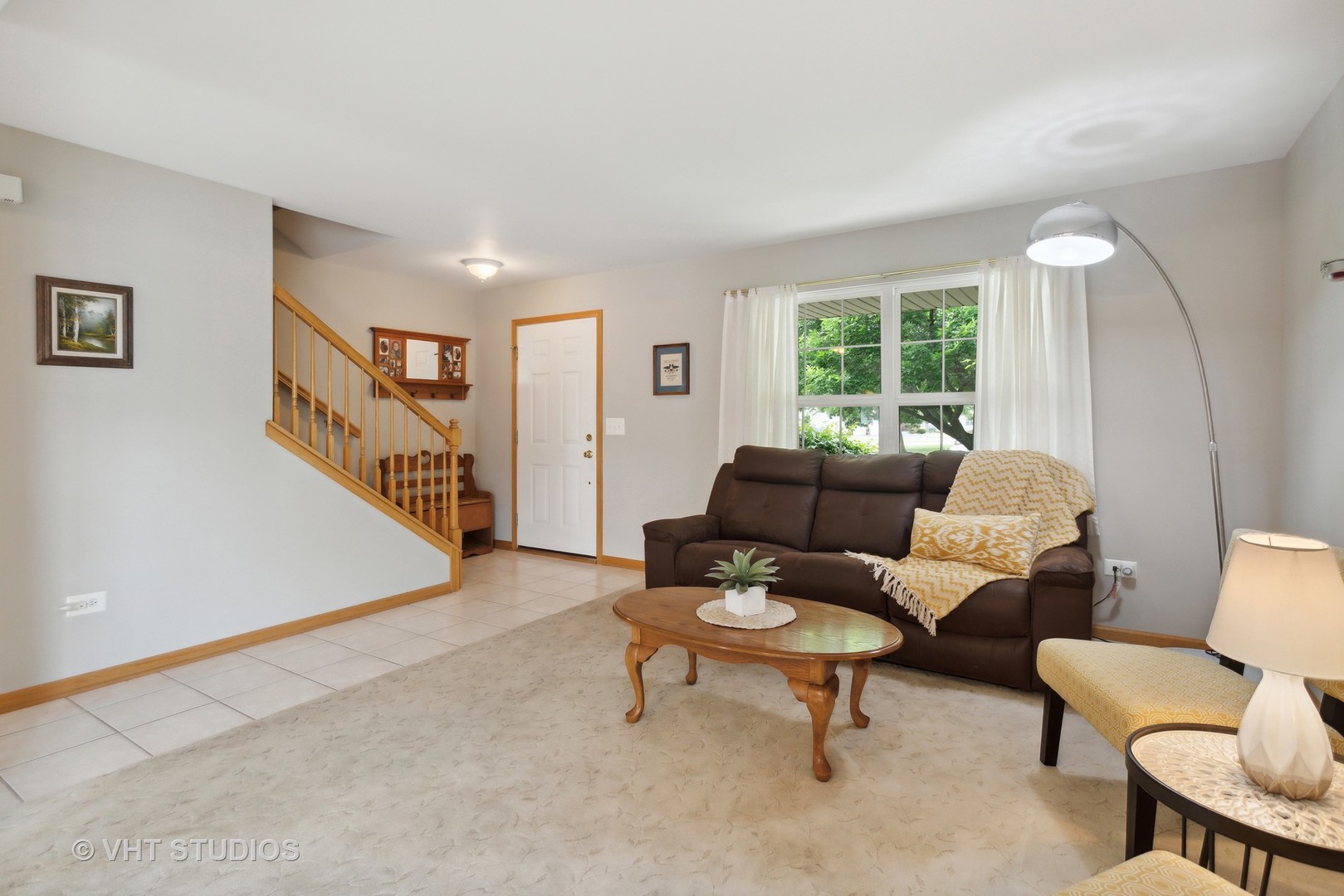 946 Premrose Court Romeoville, IL 60446 - Photo 4 of 25 a living room with furniture and a large window