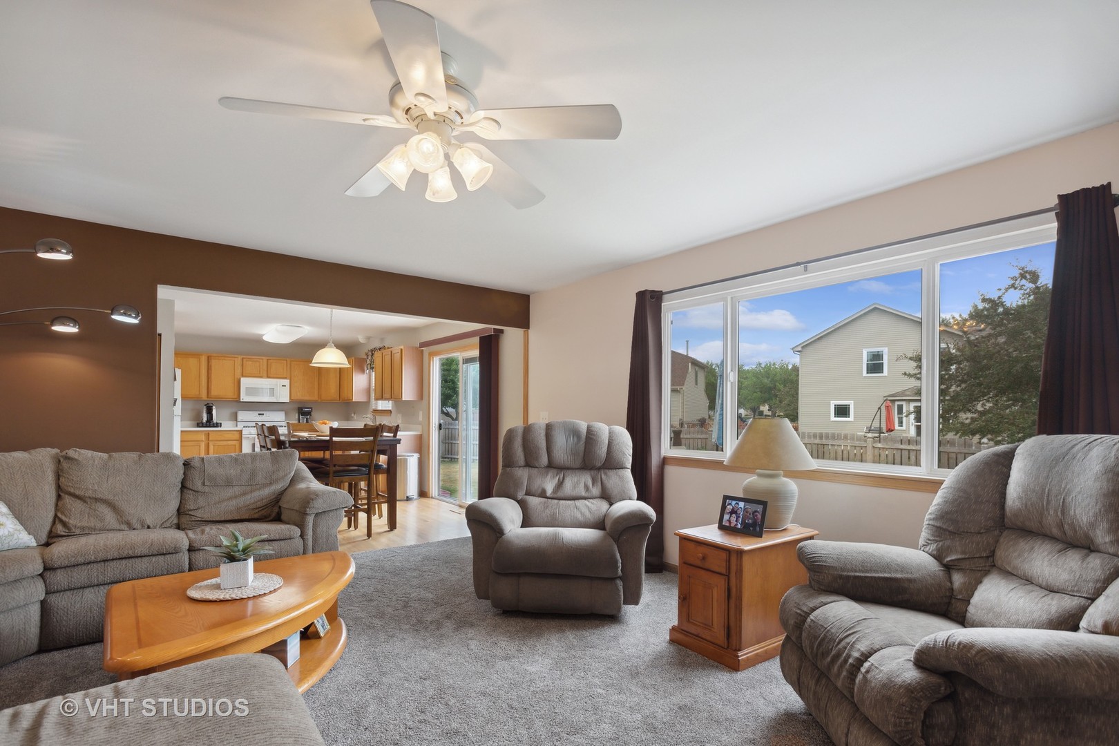 946 Premrose Court Romeoville, IL 60446 - Photo 10 of 25 a living room with furniture and a large window