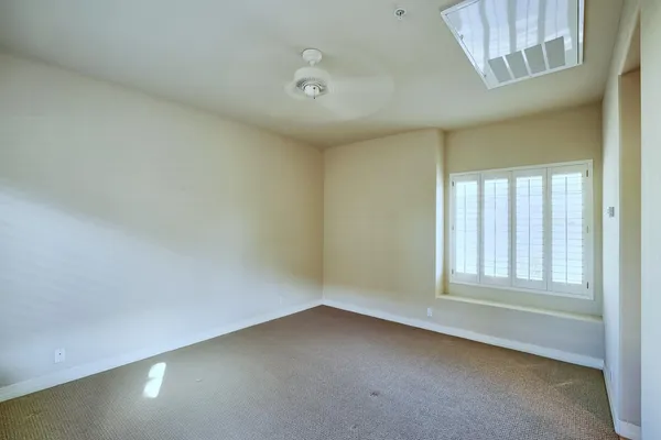 a bathroom with a granite countertop shower sink and mirror