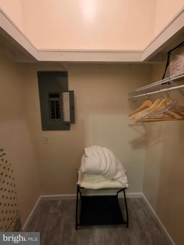 a white toilet sitting next to a shower curtain