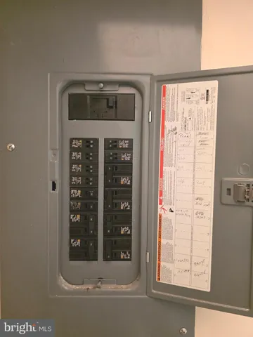 a bathroom with a sink a toilet a mirror and shower