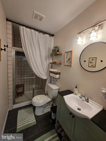 a close up of a storage and utility room with washer and dryer